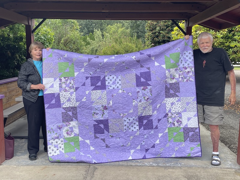 Quilt raffle winners, Bob & Carol Reule!